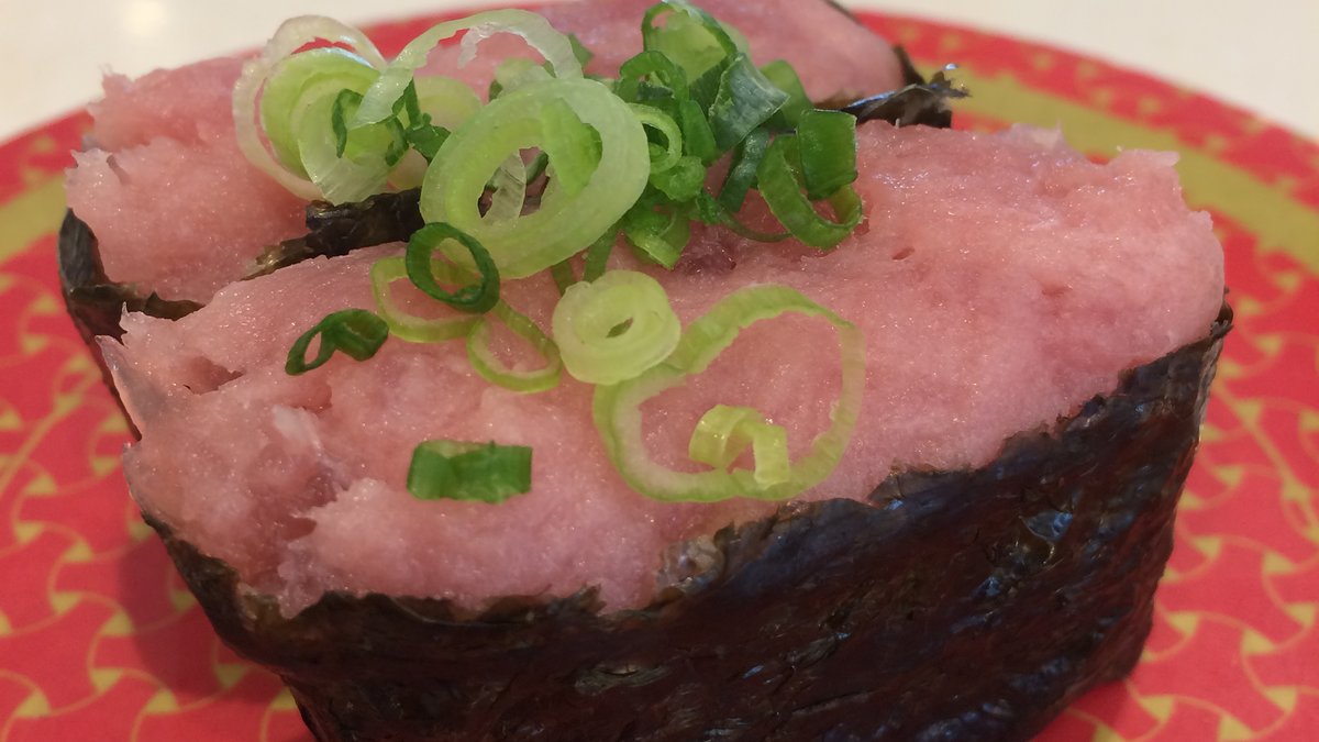 Negitoro gunkan on a plate at a conveyor belt sushi restaurant in Japan