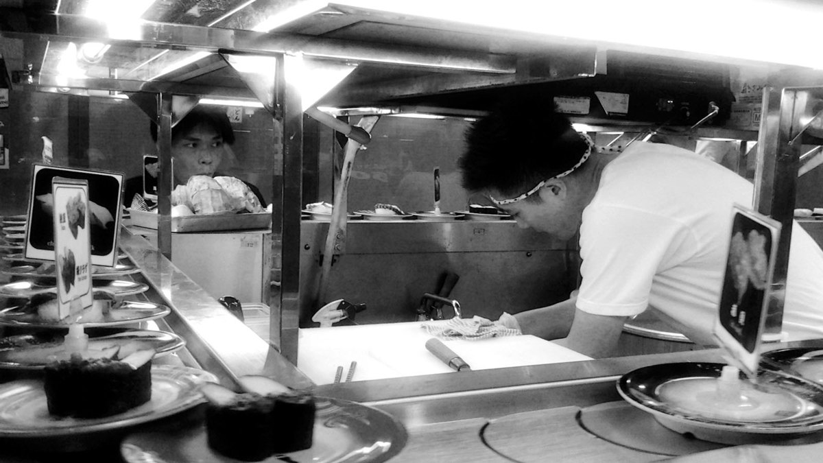 A conveyor-belt (kaiten) sushi restaurant in Japan