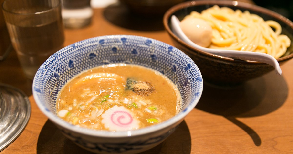 Tsukemen served at a Tokyo restaurant: a bowl of dipping broth beside a bowl of cold noodles with egg