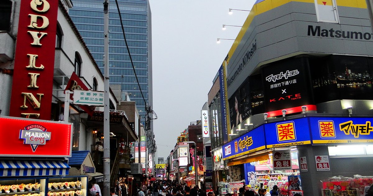 Takeshita Street in Harajuku lined with colorful shop fronts and filled with shoppers
