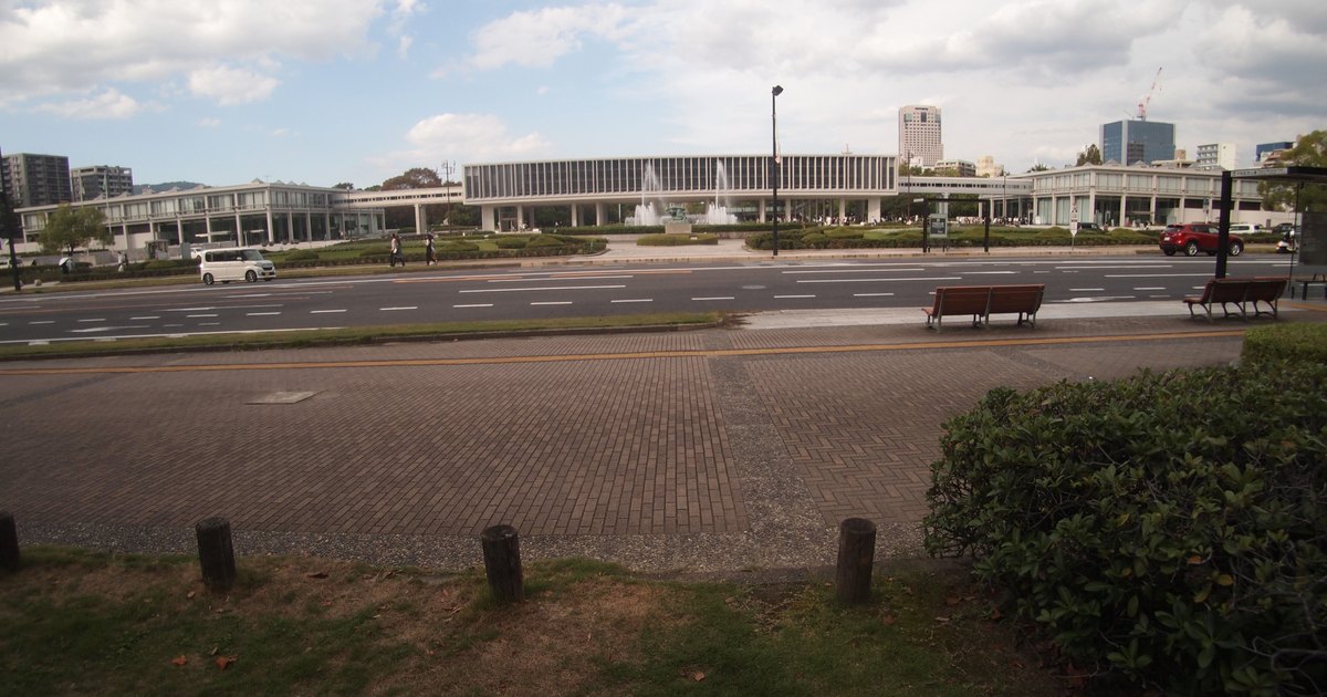 Hiroshima Peace Memorial Museum main building on its pilotis, seen quietly from across the boulevard