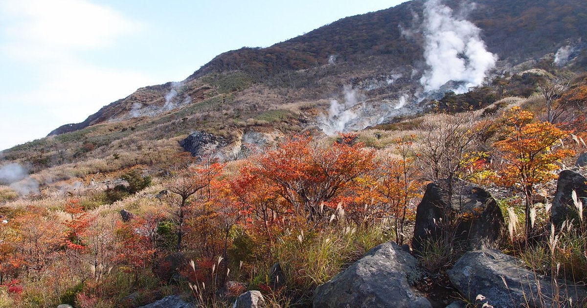 Volcanic steam rising from vents on the bare hillside at Owakudani, Hakone
