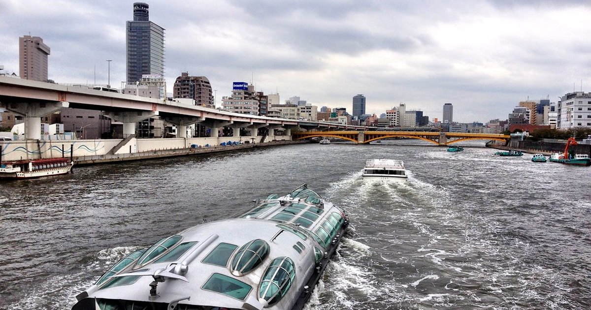 The silver spaceship-shaped Himiko water bus cruising down the Sumida River in Tokyo