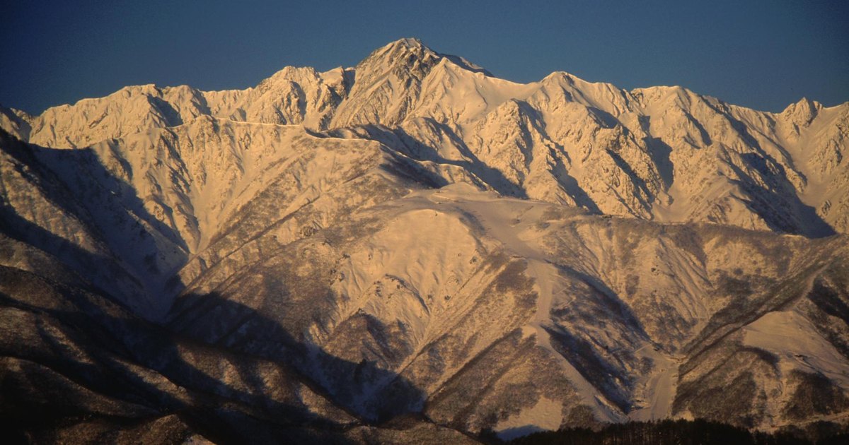 Snow-covered ridges and gullies of Mount Goryu in the Japanese Northern Alps at sunrise