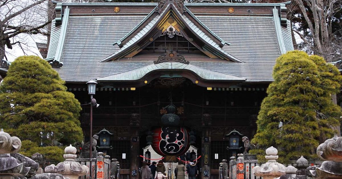 The main hall of Naritasan Shinshoji temple with a large hanging lantern in the entrance