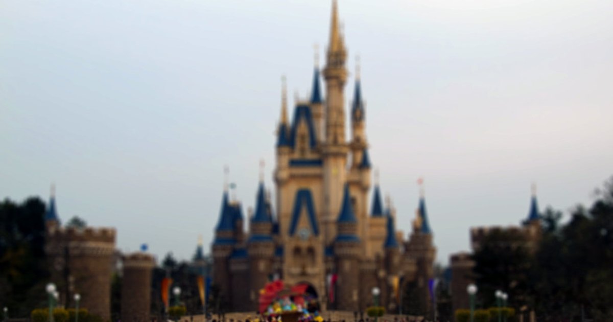 Crowds gathered on the plaza in front of Cinderella Castle at Tokyo Disneyland