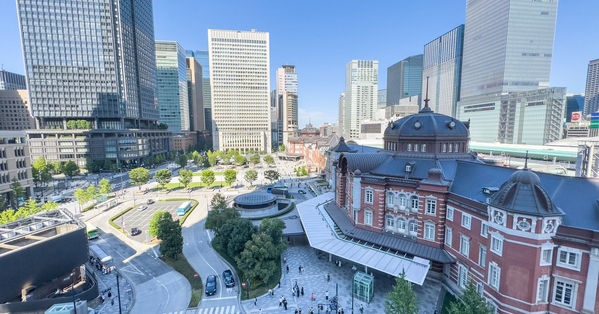 Elevated view of the red brick Marunouchi station building at Tokyo Station with office towers behind