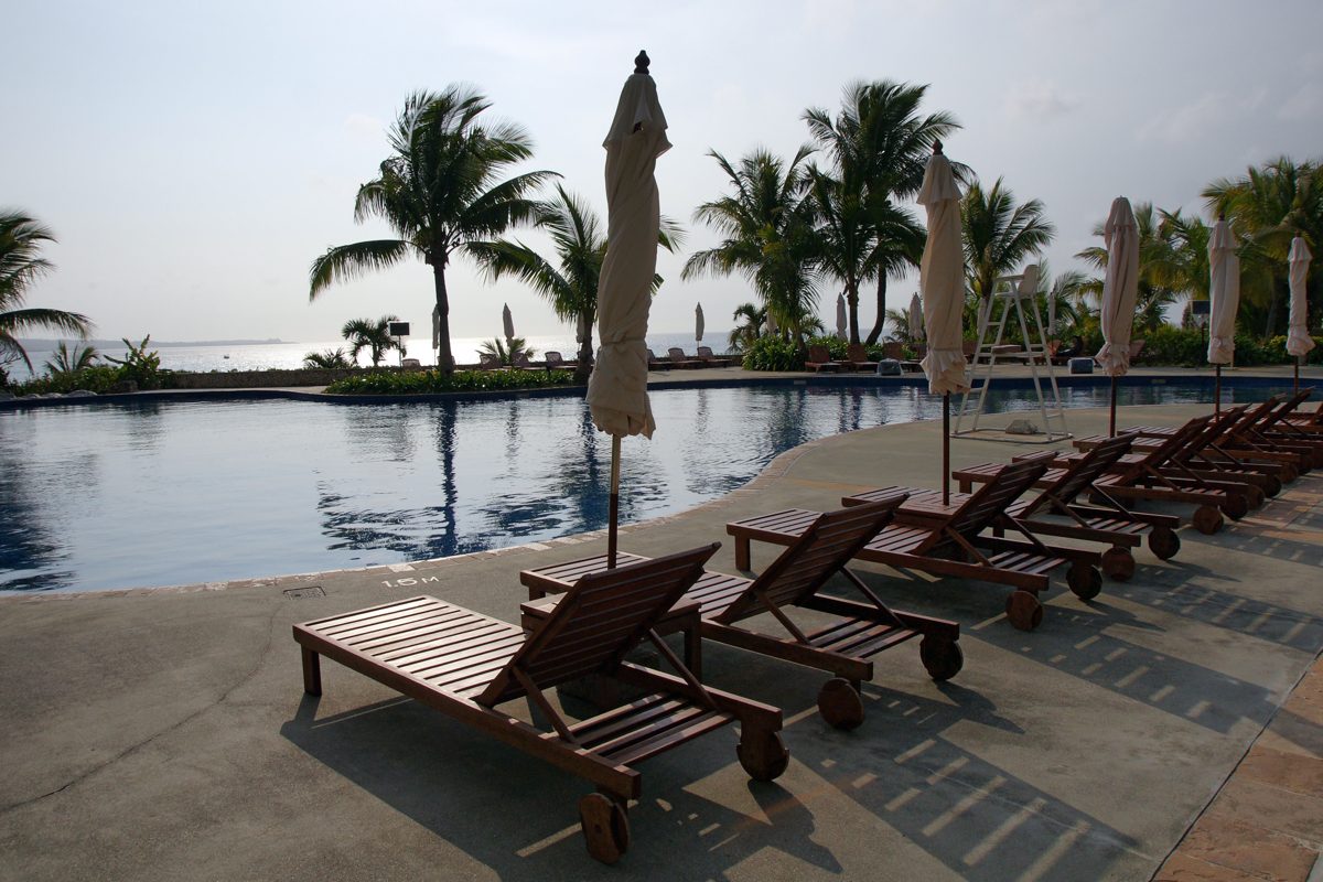 Loungers beside the outdoor pool at The Busena Terrace