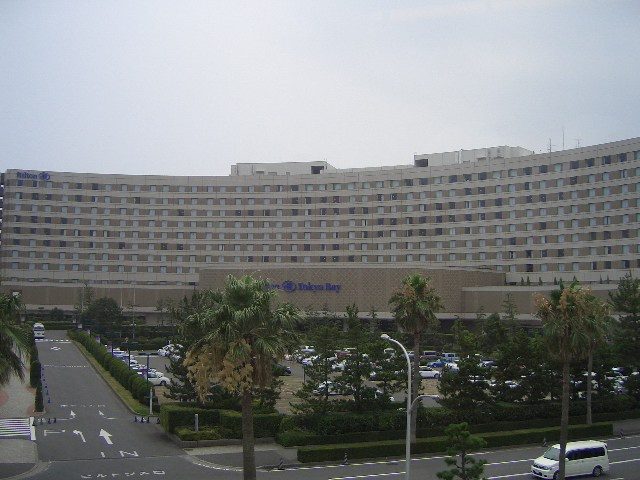 The long curved building of Hilton Tokyo Bay seen from the Disney Resort Line