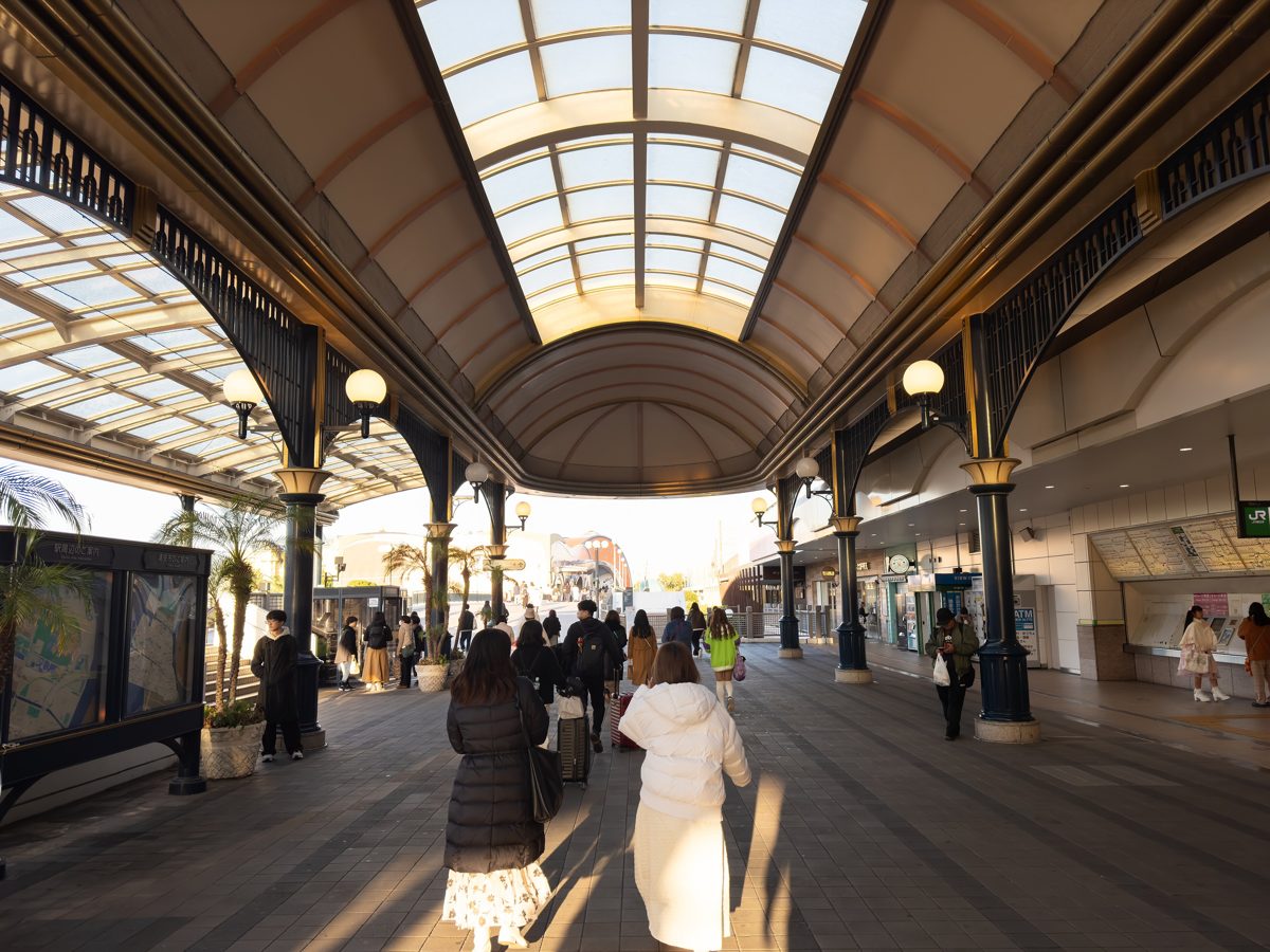 A glass-roofed walkway outside JR Maihama Station