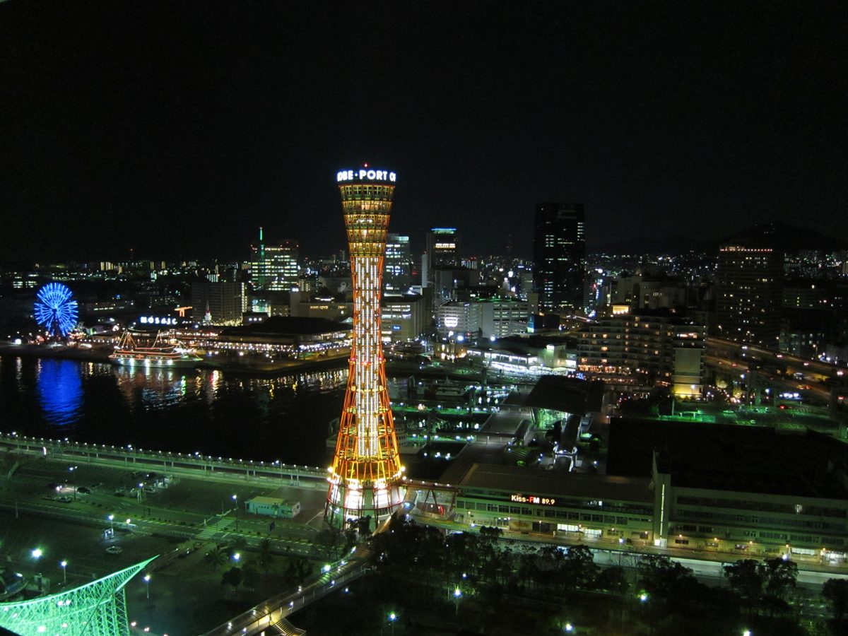 Kobe Port Tower lit up at night, seen from a high window