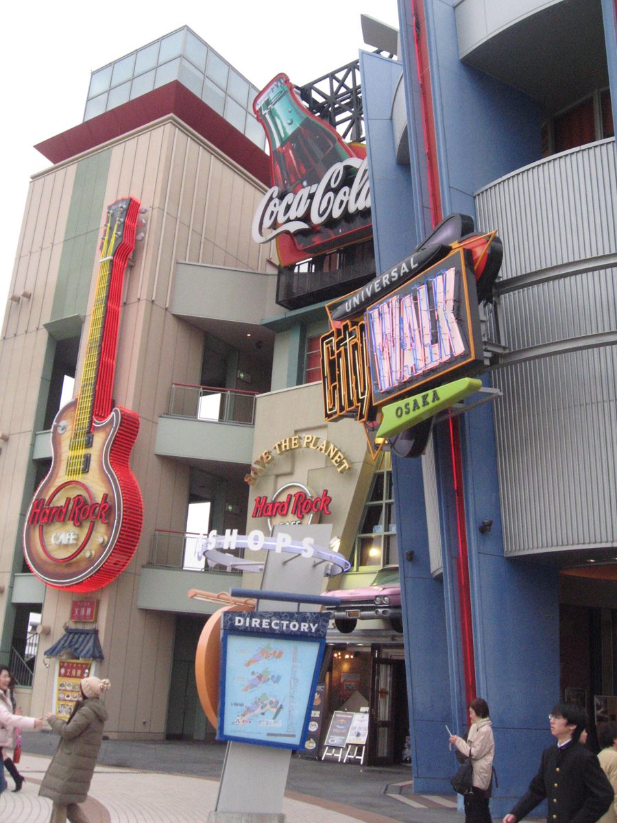 The Universal CityWalk Osaka sign and a giant guitar sign on a shopping building