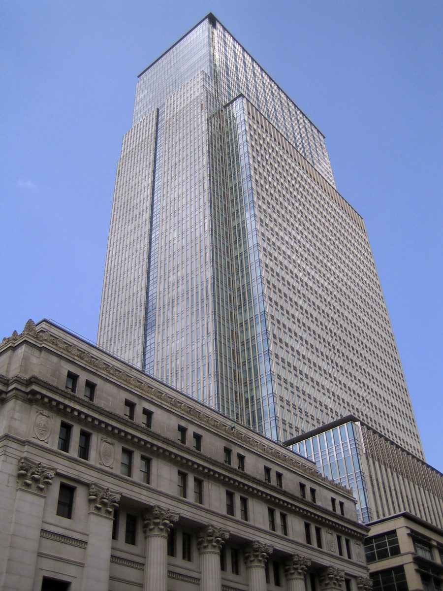 The glass Nihonbashi Mitsui Tower rising behind an older stone building in Nihonbashi Muromachi