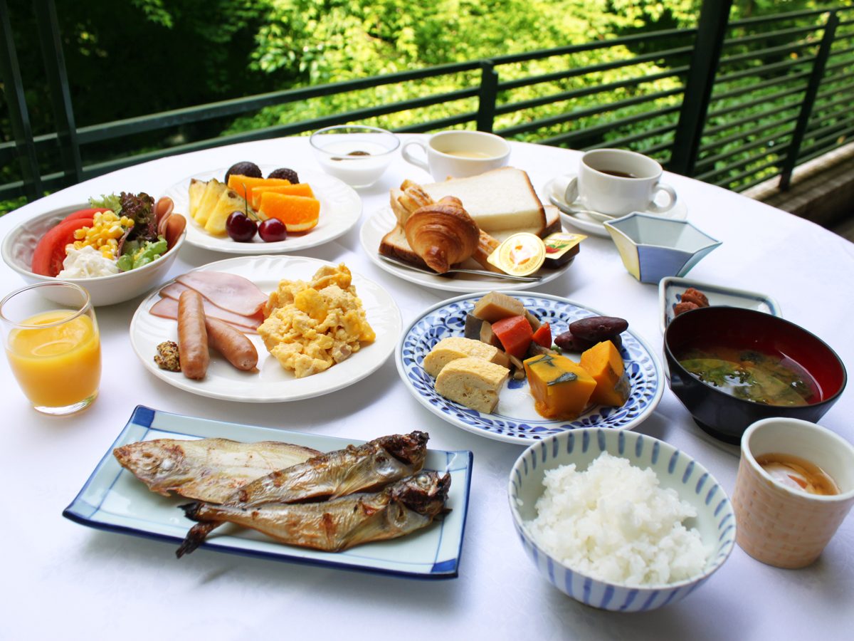 Japanese hotel breakfast tray with grilled fish, rice and miso soup