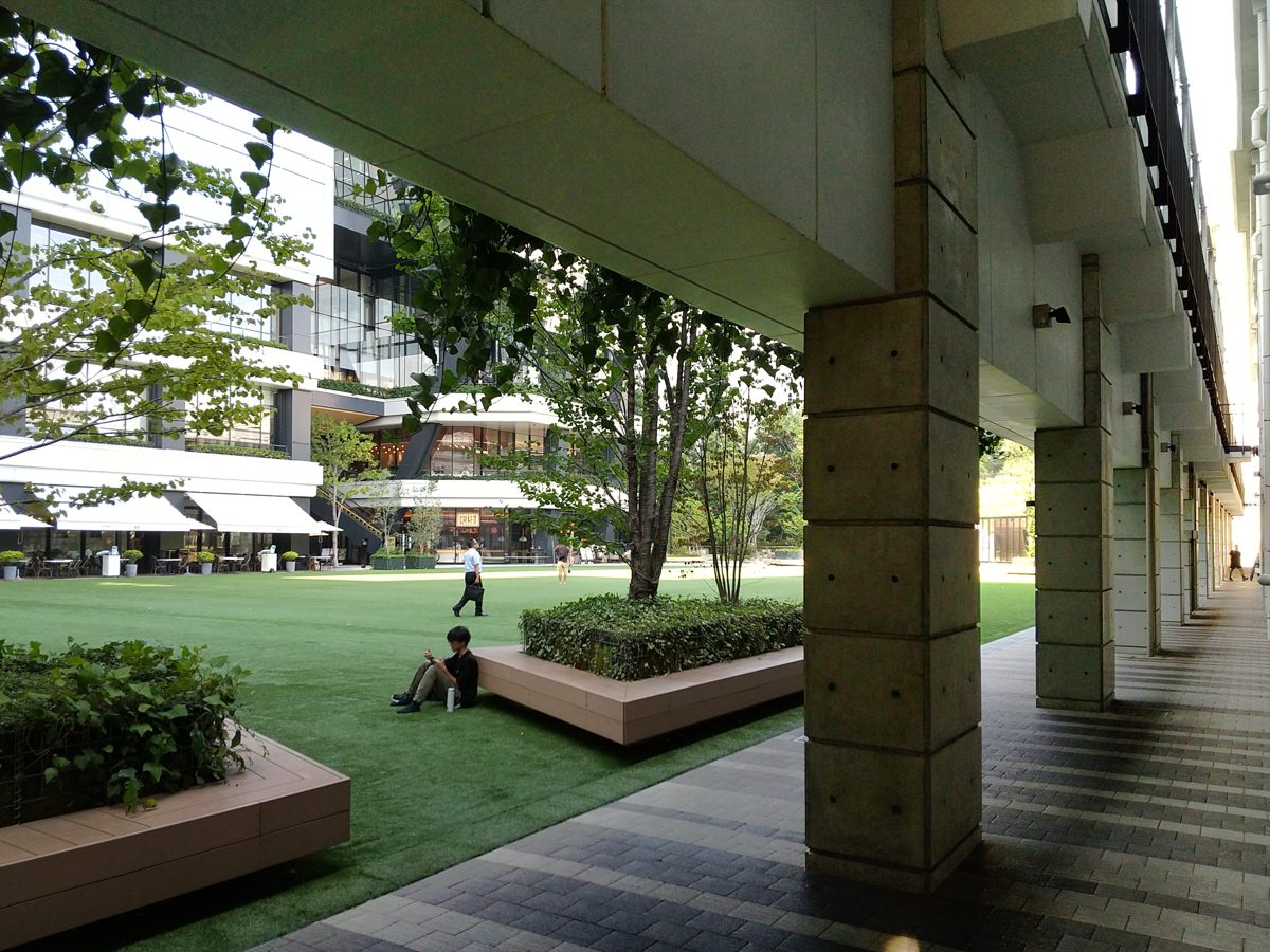 Terrace seating beneath the tower at Fukuoka Daimyo Garden City