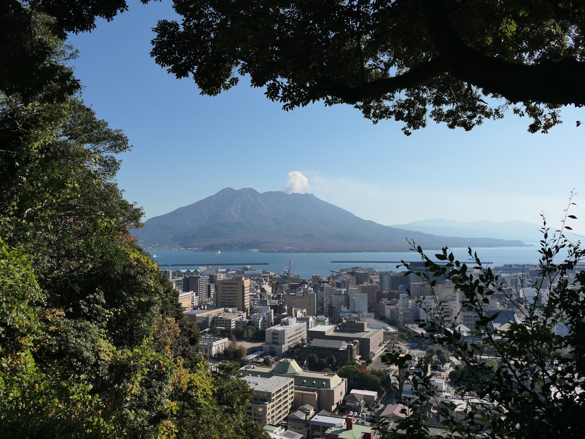 Sakurajima volcano seen across Kagoshima city from the Shiroyama hill