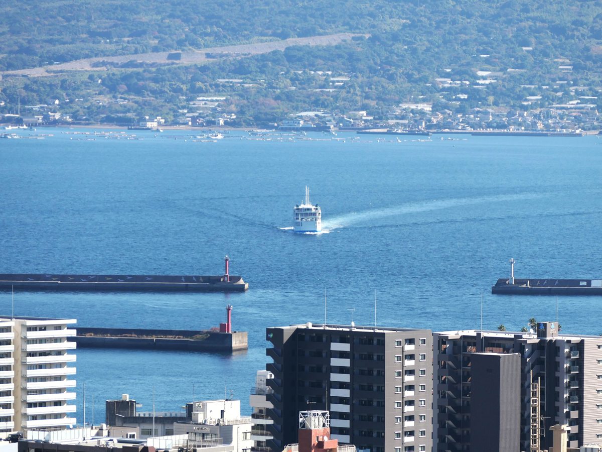 Kagoshima port with a ferry crossing the bay