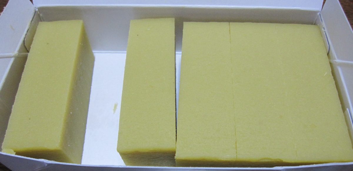 Yellow blocks of sweet potato yokan in a white box