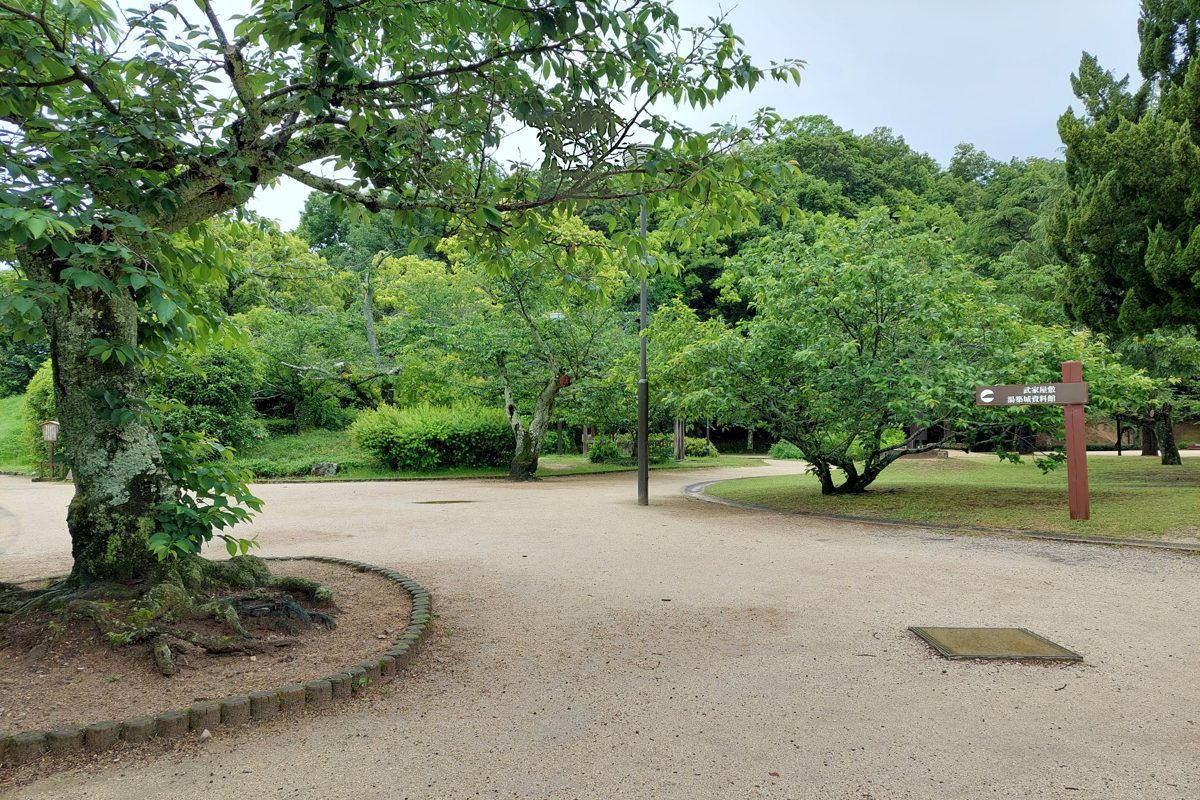 Green trees and a gravel path at Dogo Park in Matsuyama