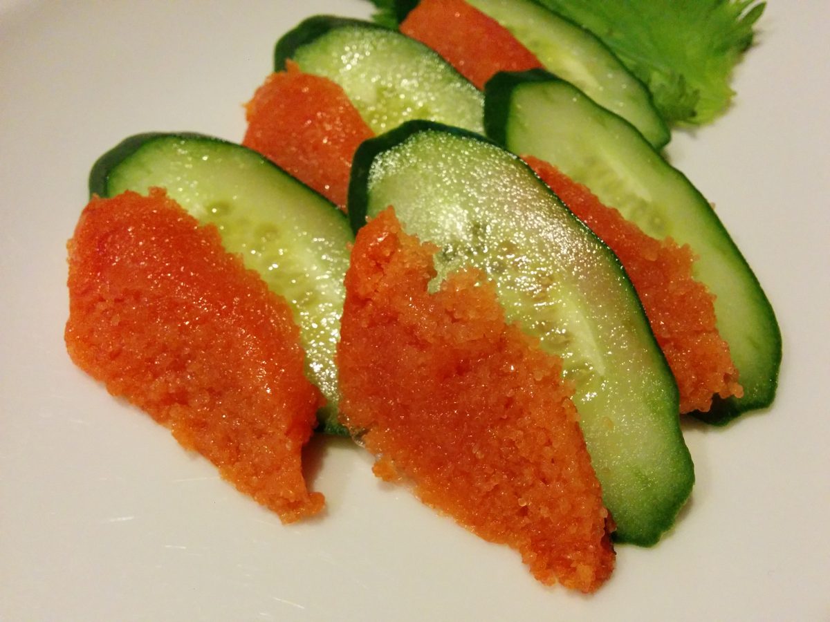 Spicy pollock roe served on slices of cucumber