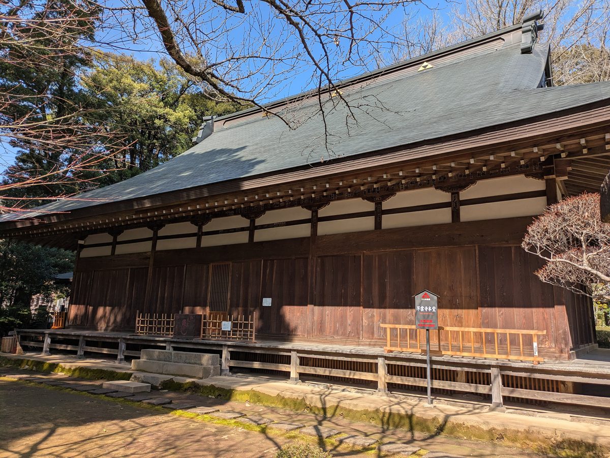 A wooden temple hall at Soun-ji with bare trees in winter