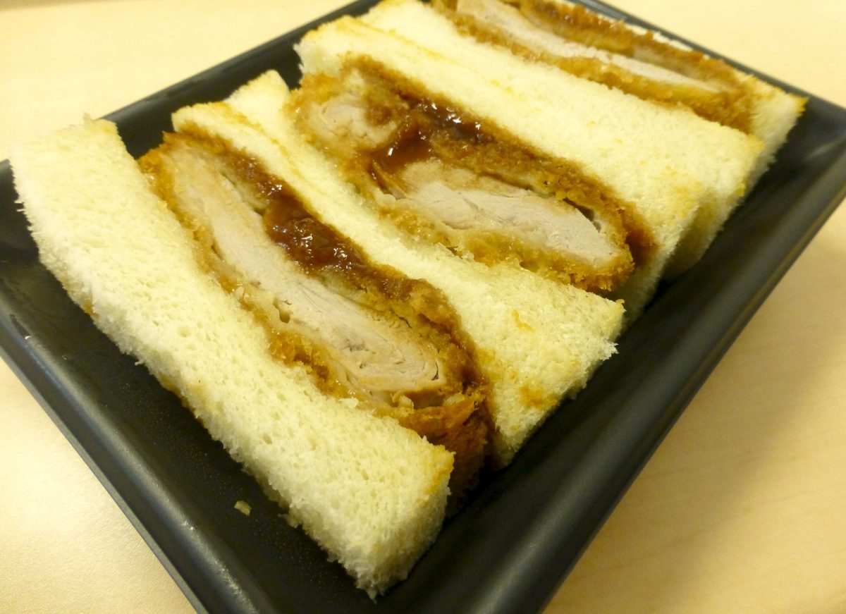 Katsu sandwiches in a black takeout tray