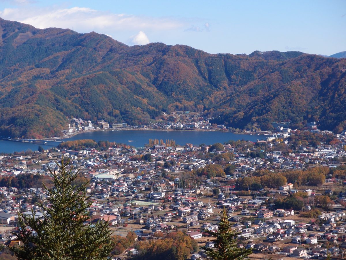 Lake Kawaguchi and the town of Fujikawaguchiko seen from a hillside in autumn