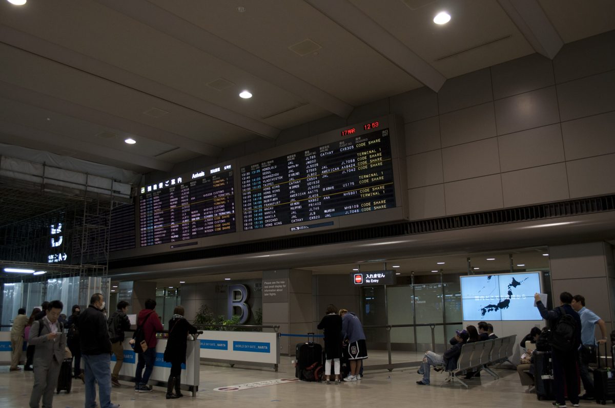 The international arrival lobby B at Narita Airport Terminal 2 with flight boards