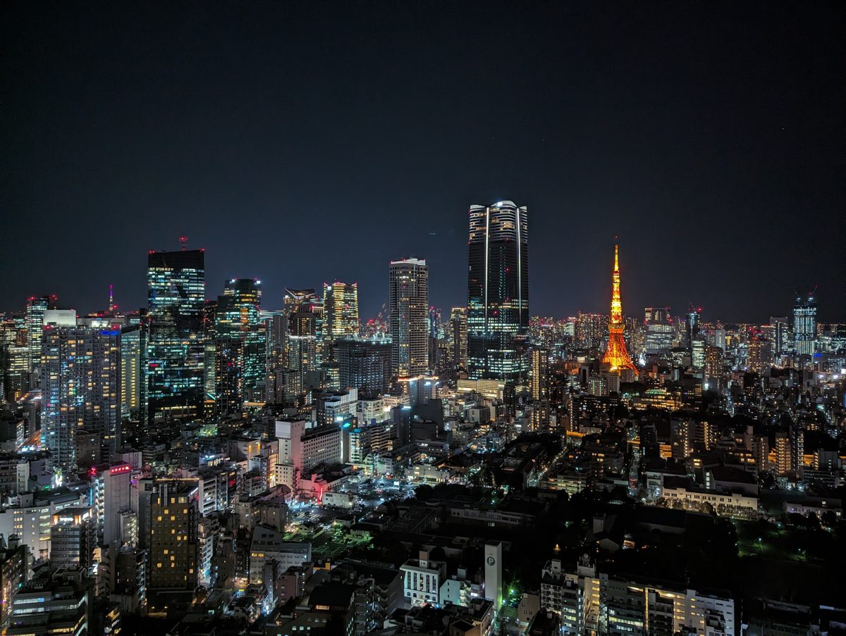 Tokyo skyline at night with the lit-up Tokyo Tower and Azabudai Hills towers