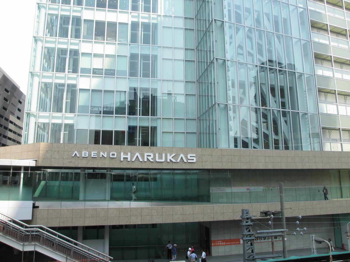 The ABENO HARUKAS name on the stone facade of the building’s lower floors, with a glass tower above