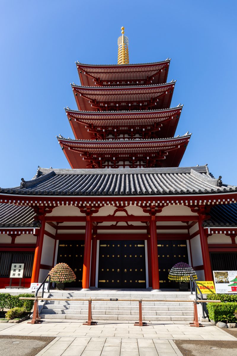 The five-story pagoda of Senso-ji against a deep blue sky