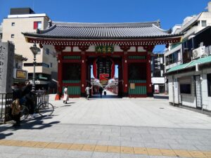 Kaminarimon gate with its large red lantern, seen across an almost empty paved street