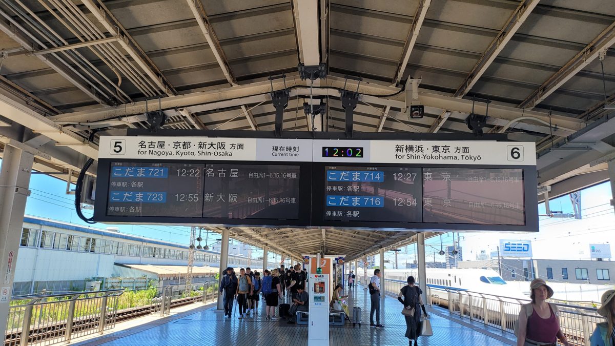 Electronic departure board hanging over a Shinkansen platform at Mishima Station