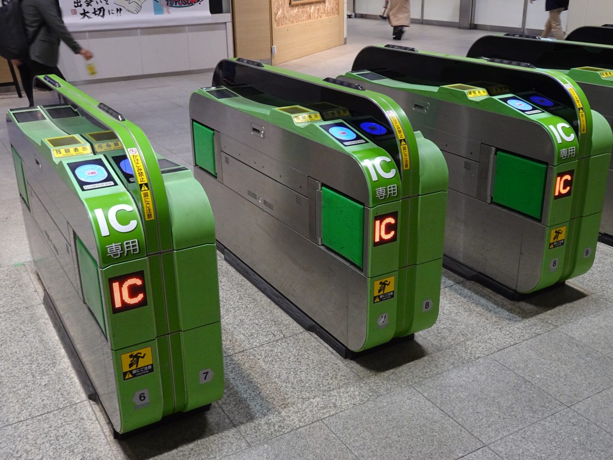 Row of green JR East automatic ticket gates with IC card readers